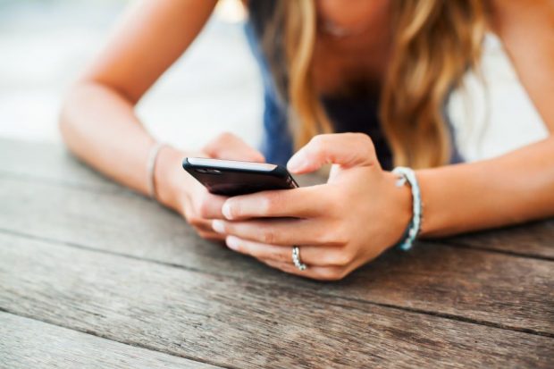 instagram_phone_smartphone_girl_social_media_facebook_shutterstock