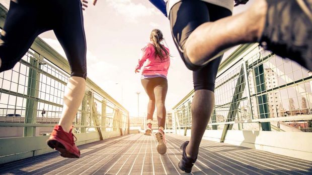 Three,Runners,Sprinting,Outdoors,-,Sportive,People,Training,In,A