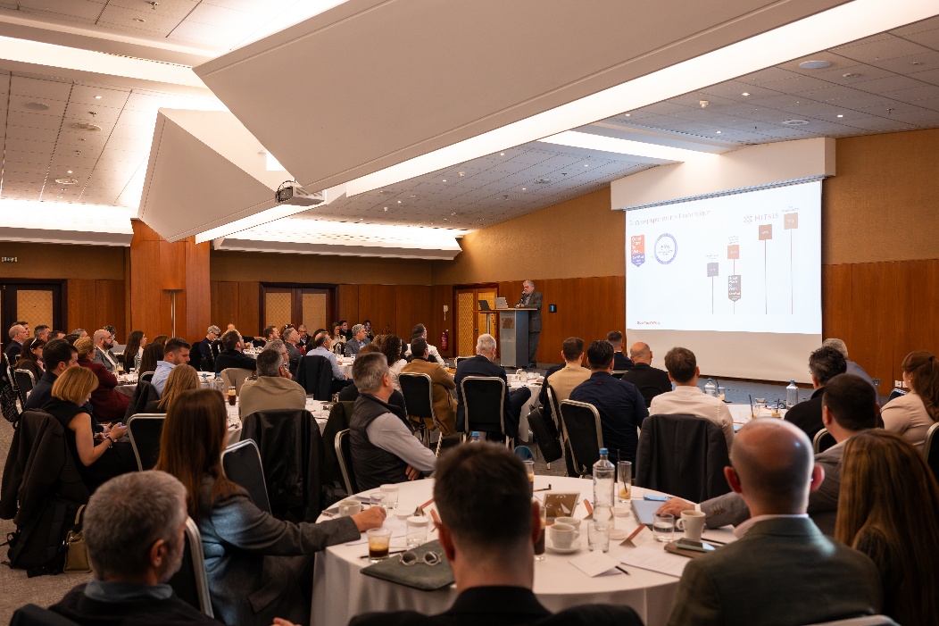 A group of people sitting at tables in a room

AI-generated content may be incorrect.