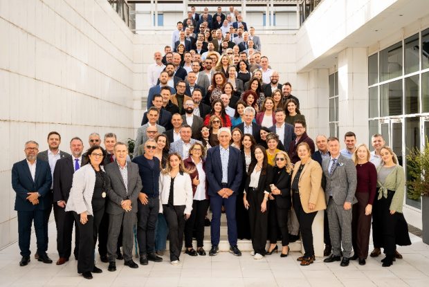 A group of people standing on a staircase AI-generated content may be incorrect.