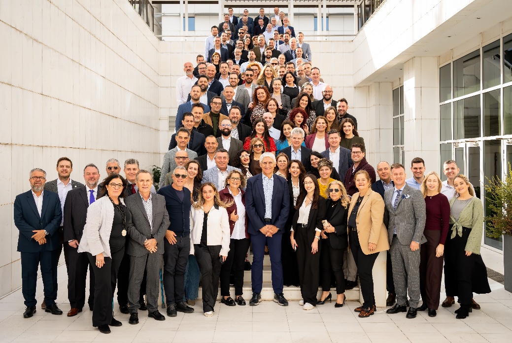 A group of people standing on a staircase AI-generated content may be incorrect.